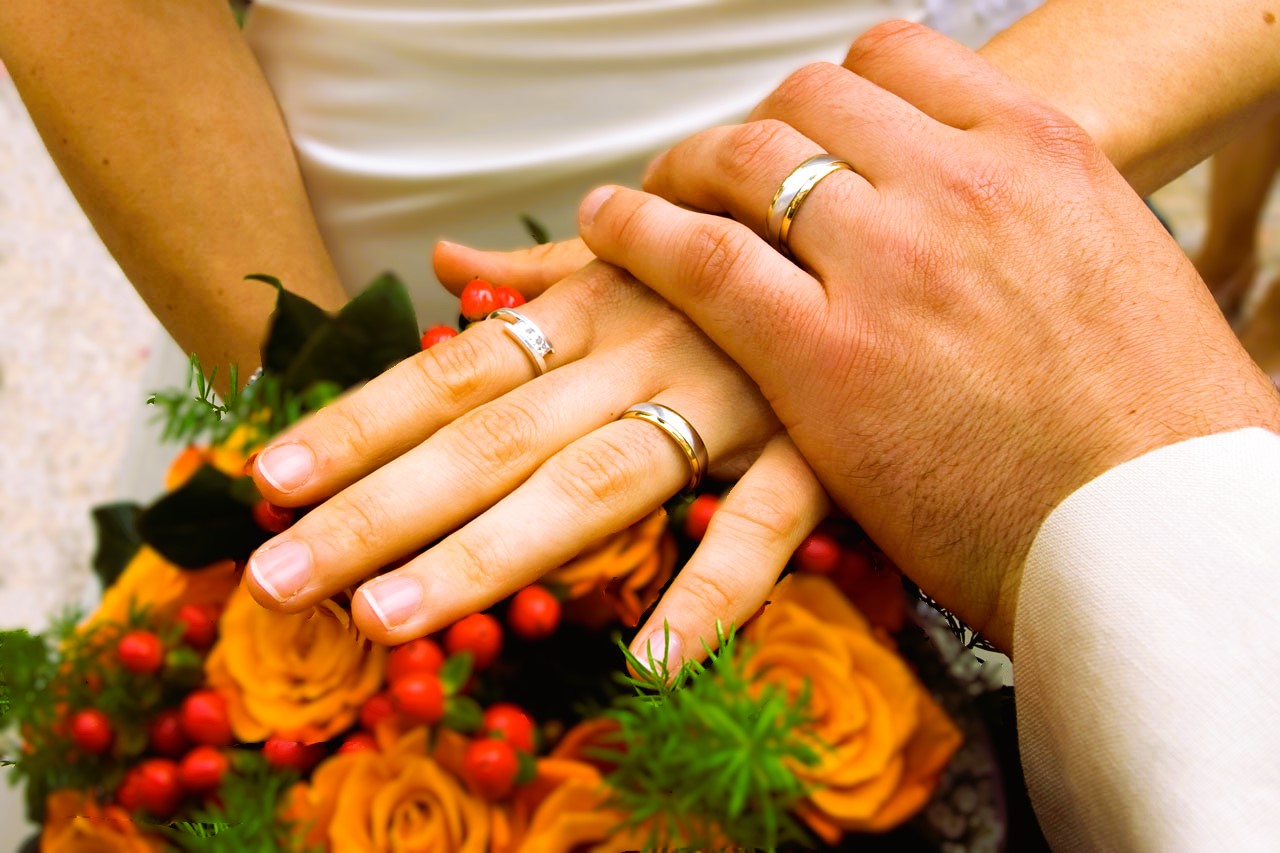 Wedding rings on fingers