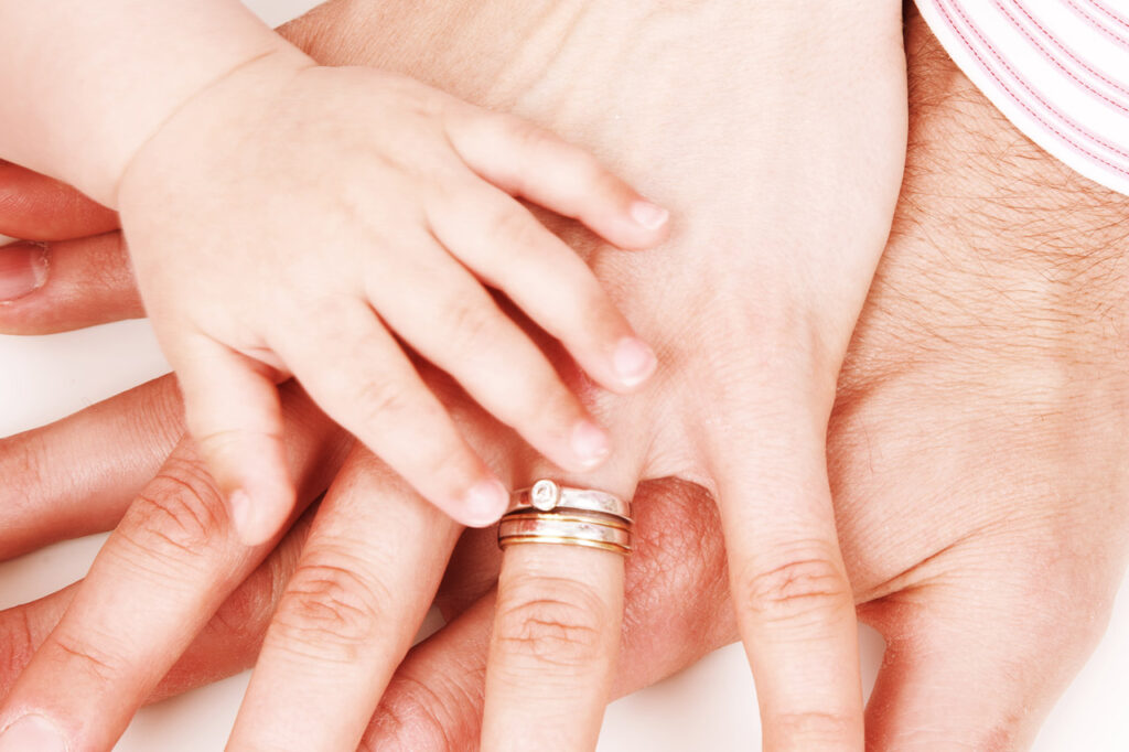 Hands Together Hands of father, mother and their baby on each other